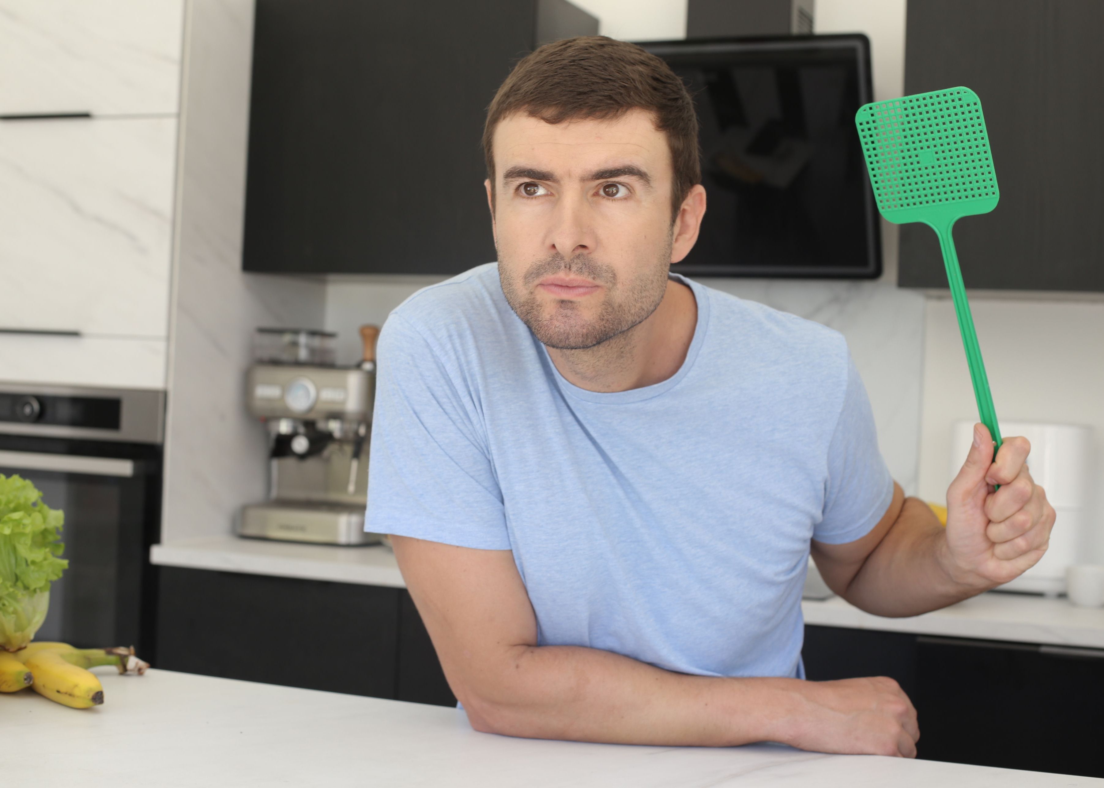 Man with fly swatter